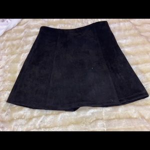 Super cute black button up skirt!